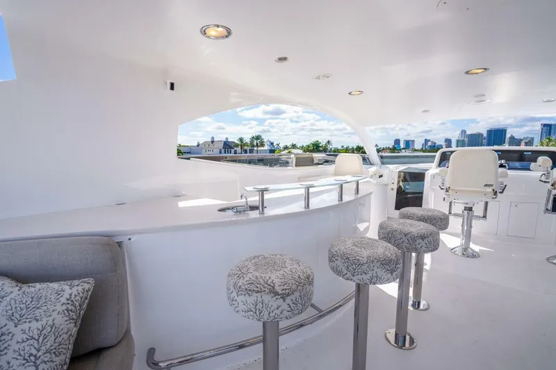 Slide: The Image of Luxurious 2008 Lazzara Motor Yacht deck with bar stools and city skyline view. - 65