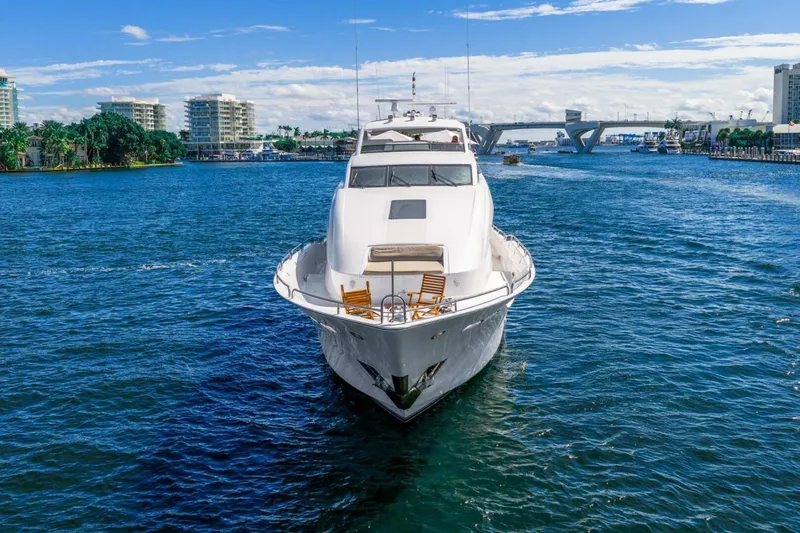 Slide: The Image of 2008 Lazzara Motor Yacht cruising on a sunny day with cityscape backdrop. - 8