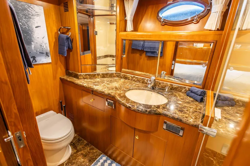 Slide: The Image of Luxurious bathroom in 2005 Ocean Alexander Raised Pilothouse Flybridge Sedan with marble countertop. - 15