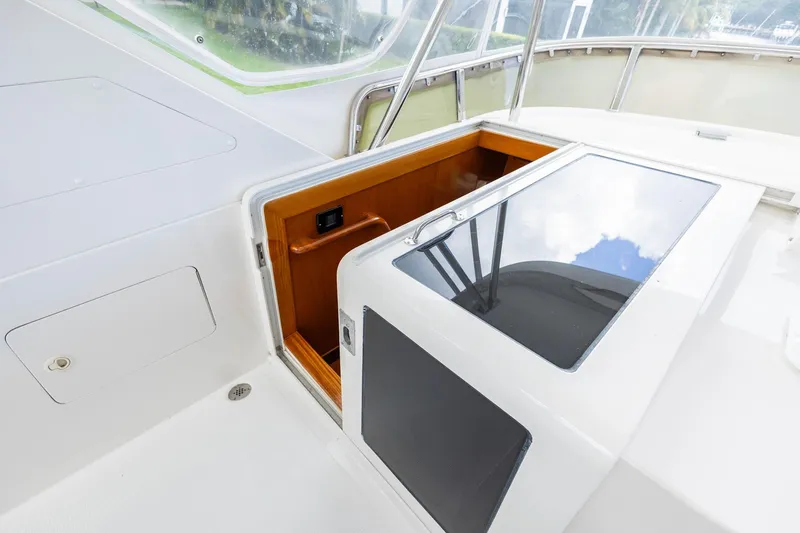 Slide: The Image of 2005 Ocean Alexander Raised Pilothouse Flybridge Sedan, featuring sleek deck design and hatch. - 19