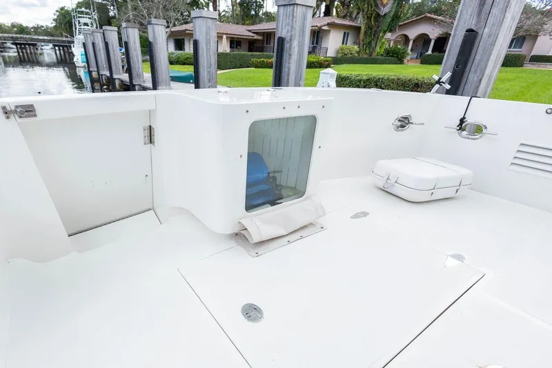 Slide: The Image of 2005 Ocean Alexander Raised Pilothouse Flybridge Sedan deck with storage and seating area. - 31