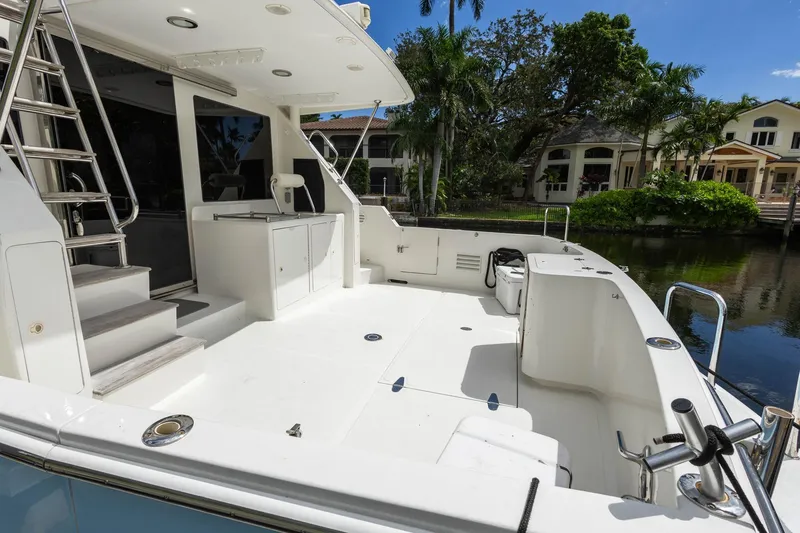Slide: The Image of 2005 Ocean Alexander Raised Pilothouse Flybridge Sedan yacht deck with sleek design and waterfront view. - 34