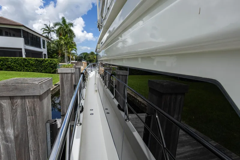 Slide: The Image of 2005 Ocean Alexander Raised Pilothouse Flybridge Sedan docked by wooden posts. - 35