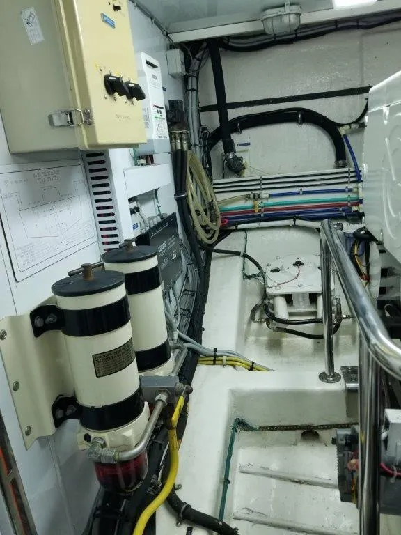 Slide: The Image of Engine room of 2005 Ocean Alexander Raised Pilothouse Flybridge Sedan with visible wiring and equipment. - 38