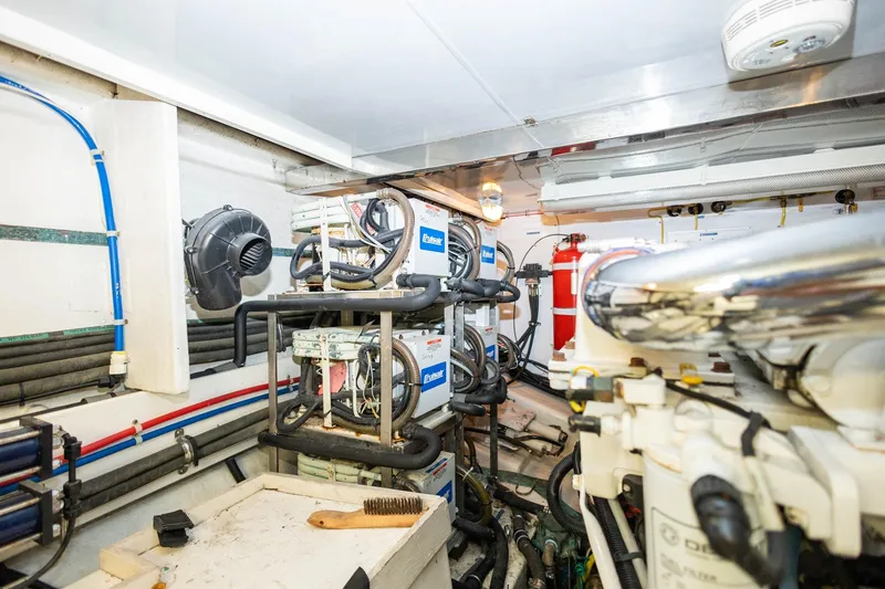 Slide: The Image of Engine room of 2005 Ocean Alexander Raised Pilothouse Flybridge Sedan, featuring mechanical equipment and piping. - 40