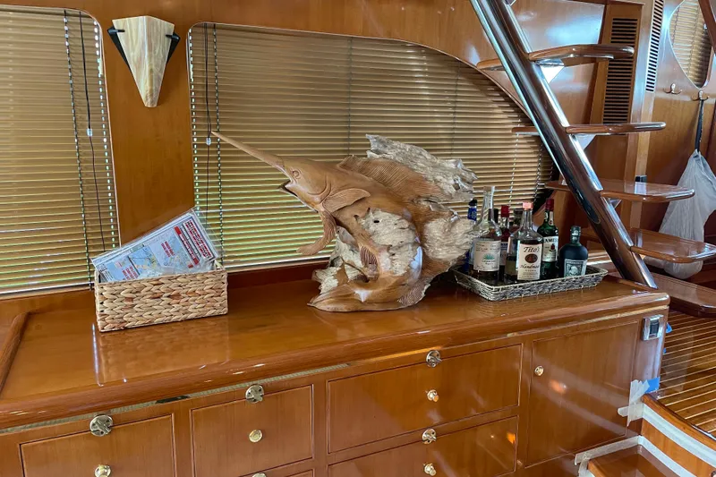 Slide: The Image of Luxurious 2005 Ocean Alexander yacht interior with wooden decor and bar setup. - 5