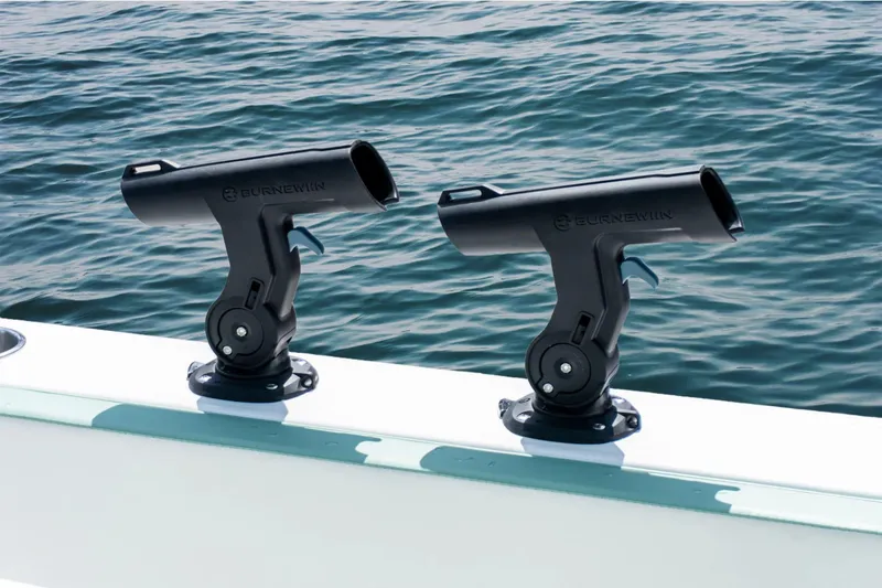 Slide: The Image of Twin Vee 280 STX CC 2026 with fishing rod holders on water. - 12