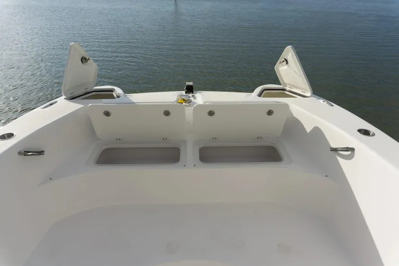 Slide: The Image of 2026 Twin Vee 280 STX CC boat with open storage hatch. - 2