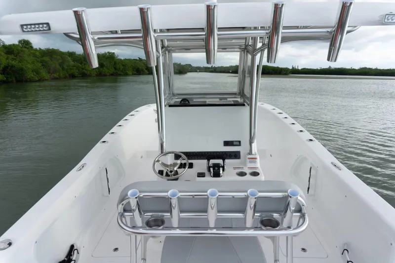 Slide: The Image of Interior view of 2026 Twin Vee 280 STX CC boat on calm waters. - 4