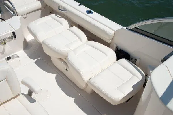 Slide: The Image of Manufacturer Provided Image: Woman driving a 2017 Grady-White Freedom 205 boat on the water. - 9