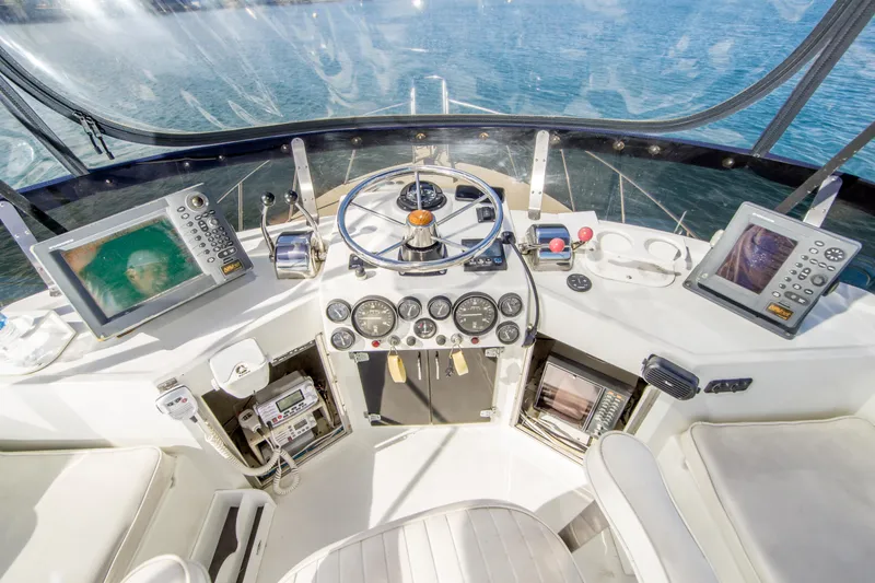 Slide: The Image of Cockpit of 1996 Blackman Sportfisher 32 with navigation equipment and steering wheel. - 10