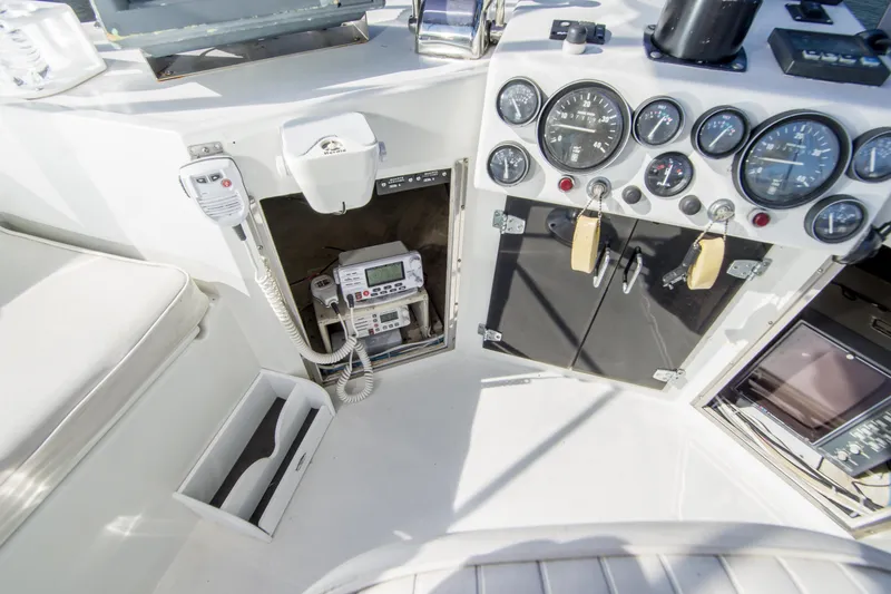 Slide: The Image of 1996 Blackman Sportfisher 32 cockpit with gauges, radio, and control panel. - 11