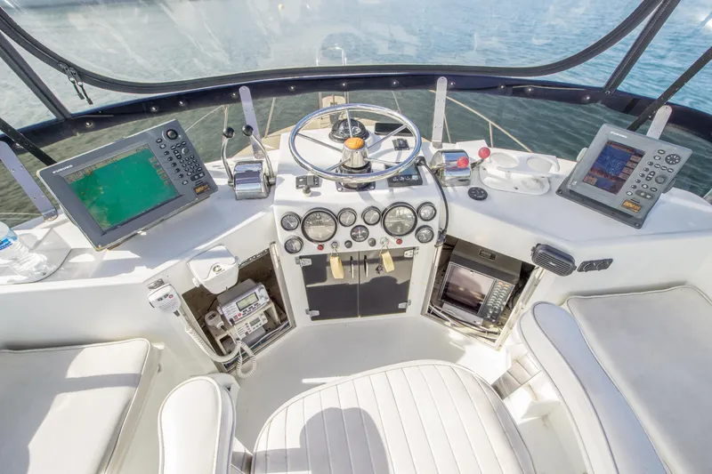 Slide: The Image of Cockpit of 1996 Blackman Sportfisher 32 with navigation equipment and steering wheel. - 7
