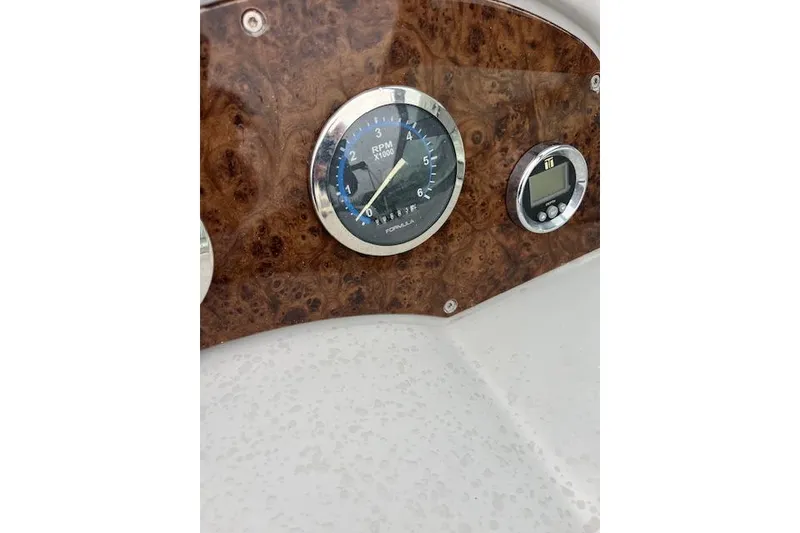 Slide: The Image of Dashboard of a 2004 Formula 26 Performance Cruiser with RPM gauge and digital display. - 10