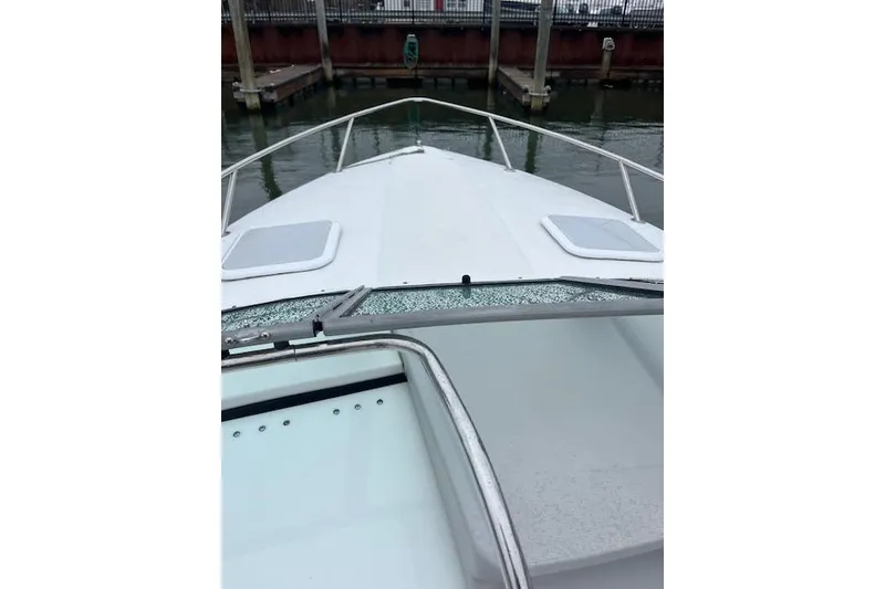 Slide: The Image of 2004 Formula 26 Performance Cruiser boat docked, view from the bow. - 12