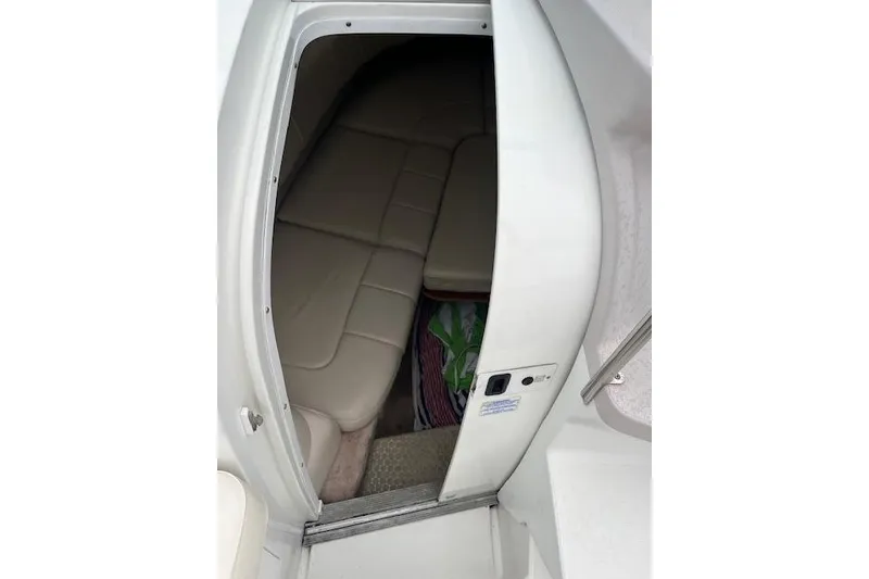 Slide: The Image of 2004 Formula 26 Performance Cruiser cabin interior with beige seating and compact design. - 13