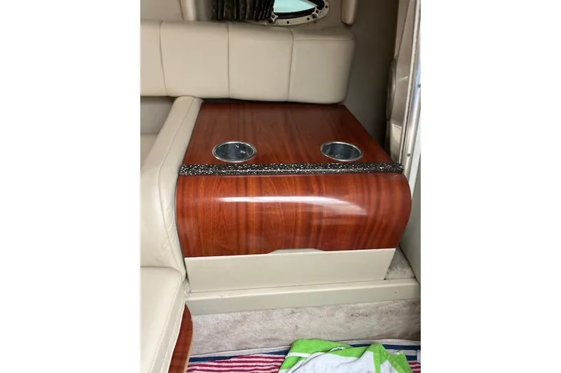 Slide: The Image of Interior of 2004 Formula 26 Performance Cruiser with wood finish and cup holders. - 15