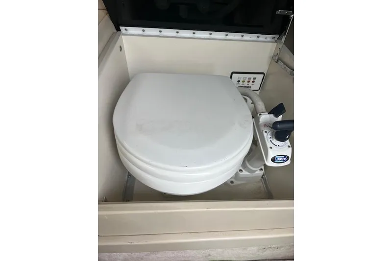Slide: The Image of 2004 Formula 26 Performance Cruiser marine toilet with manual pump system. - 16