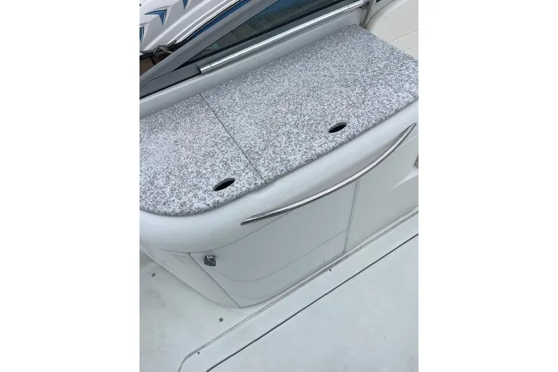 Slide: The Image of 2004 Formula 26 Performance Cruiser boat interior with sleek design and textured surface. - 18