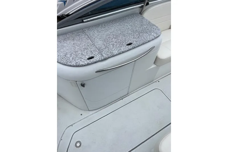 Slide: The Image of 2004 Formula 26 Performance Cruiser interior with gray upholstery and sleek design. - 19