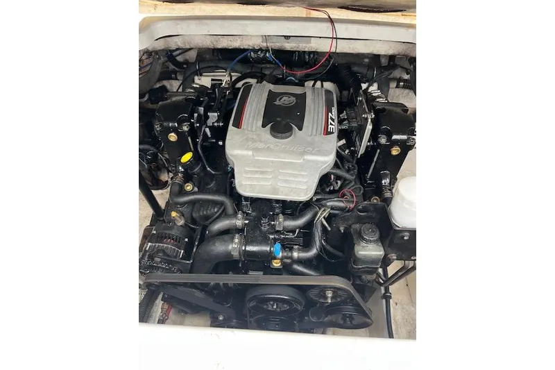 Slide: The Image of Engine of a 2004 Formula 26 Performance Cruiser boat, showcasing MerCruiser components. - 20