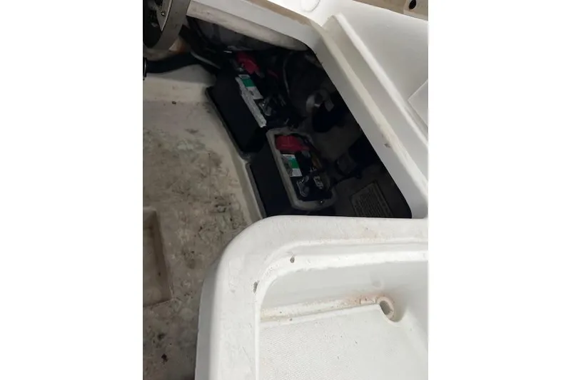 Slide: The Image of 2004 Formula 26 Performance Cruiser battery compartment with visible wiring and components. - 21