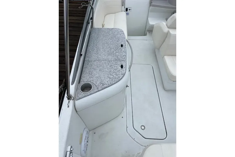 Slide: The Image of 2004 Formula 26 Performance Cruiser interior with white seating and countertop. - 4