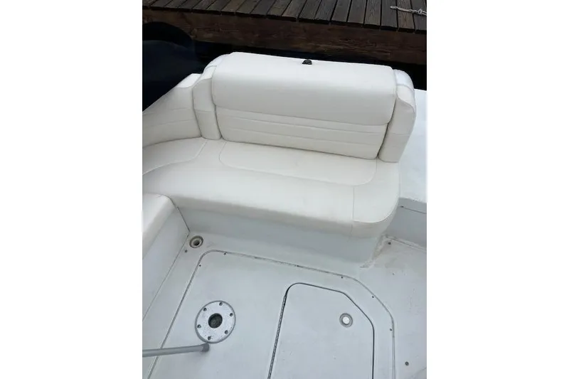Slide: The Image of 2004 Formula 26 Performance Cruiser interior with white seating and deck details. - 5