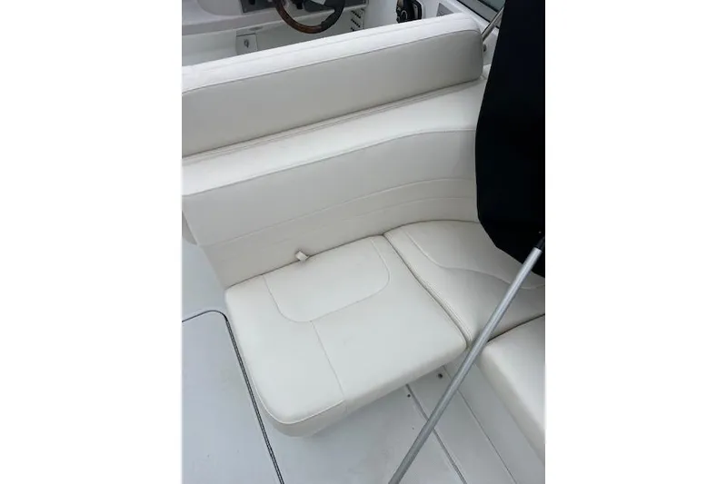 Slide: The Image of 2004 Formula 26 Performance Cruiser interior with white seating and steering wheel. - 6