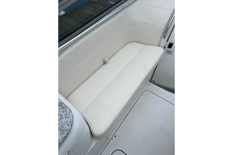 Slide: The Image of 2004 Formula 26 Performance Cruiser interior with white cushioned seating. - 7