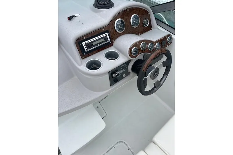 Slide: The Image of 2004 Formula 26 Performance Cruiser dashboard with steering wheel and instrument panel. - 9