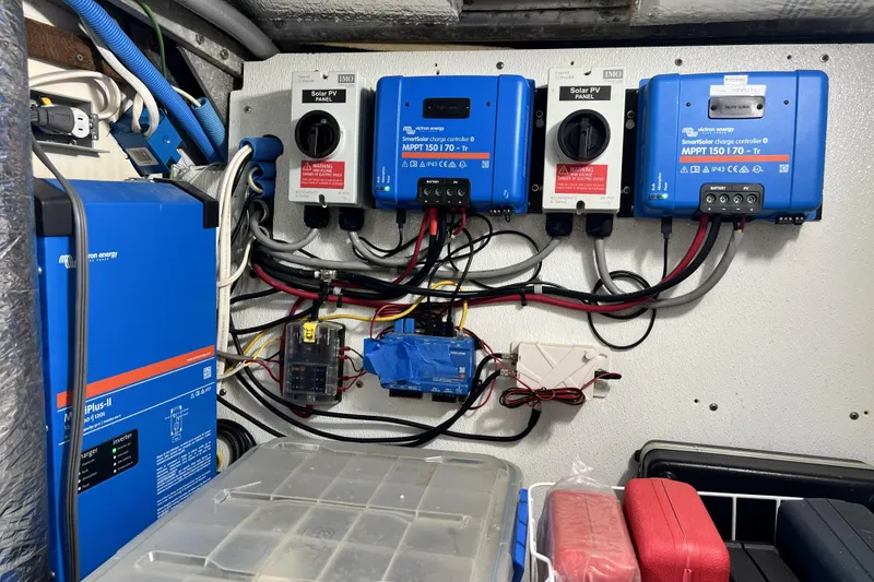 Slide: The Image of Electrical setup with Victron Energy components in a Pinical 14-34, 1985 model. - 11