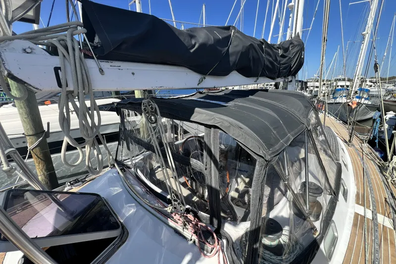 Slide: The Image of Sailboat docked at marina, Pinical 14-34 model, 1985, with covered cockpit and rigging. - 21