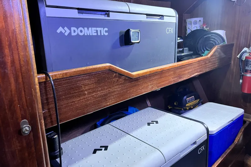 Slide: The Image of Dometic CFX fridge in a 1985 Custom Pinical 14-34. - 24