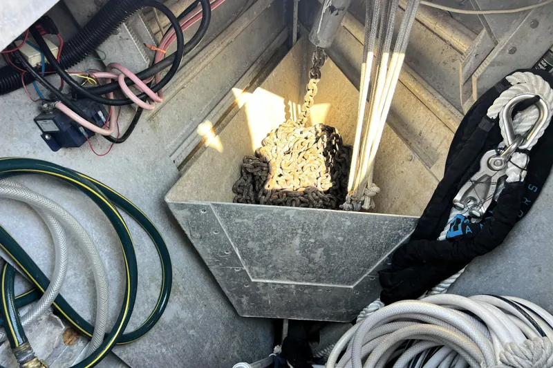 Slide: The Image of Anchor chain and ropes in a 1985 Pinical 14-34 boat compartment. - 25