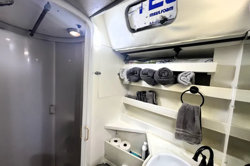 Slide: The Image of Bathroom interior of 1985 Custom Pinical 14-34 with towels and toiletries. - 35