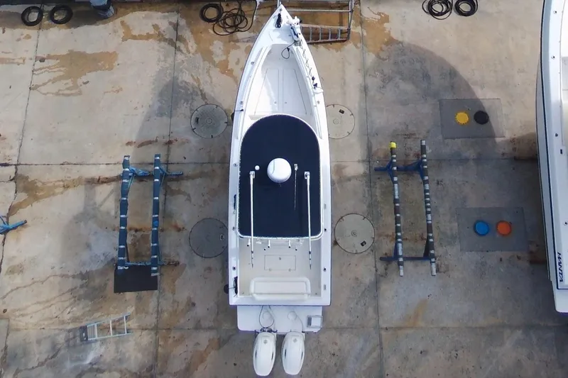 Slide: The Image of Aerial view of 2003 Island Runner 26 Center Console boat on dry dock. - 6