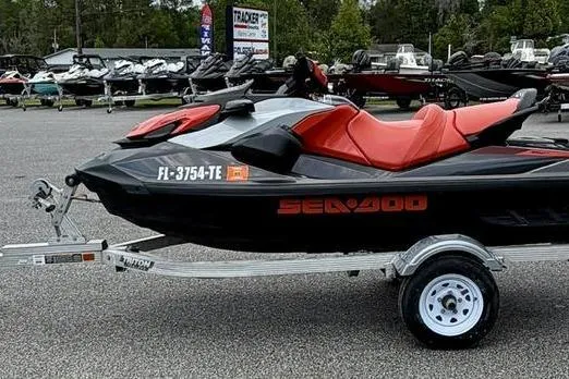 Slide: The Image of 2022 Sea-Doo GTI SE 130 jet ski on trailer, parked in a dealership lot. - 4