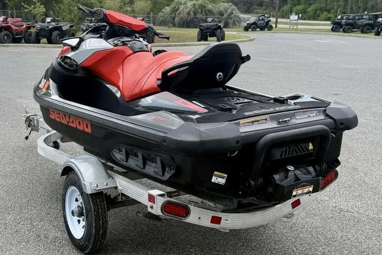 Slide: The Image of 2022 Sea-Doo GTI SE 130 jet ski on trailer, featuring red and black design. - 5