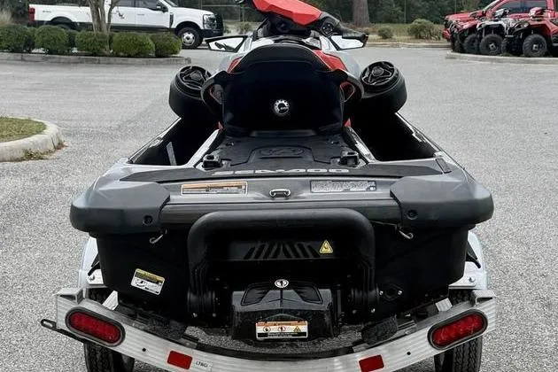 Slide: The Image of 2022 Sea-Doo GTI SE 130 jet ski on trailer, rear view in parking lot. - 6