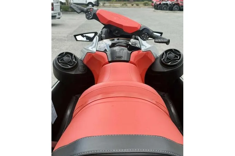 Slide: The Image of 2022 Sea-Doo GTI SE 130, red seat and handlebars, parked outdoors. - 8