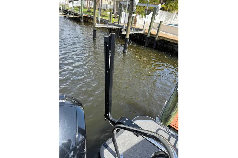 Slide: The Image of 2023 Starcraft EXS 3 Q boat docked by a waterfront pier. - 19