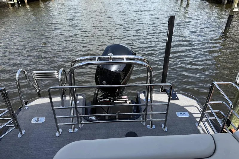 Slide: The Image of 2023 Starcraft EXS 3 Q boat with motor, docked on calm water. - 20