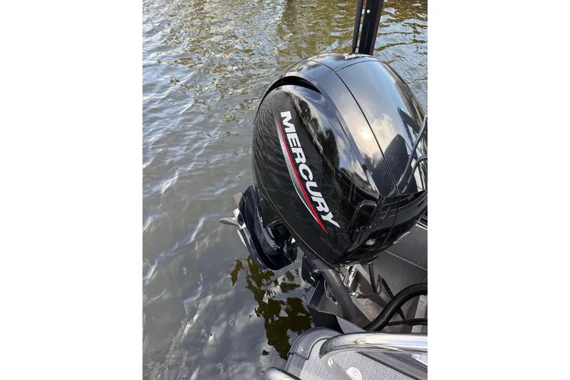 Slide: The Image of 2023 Starcraft EXS 3 Q boat with Mercury outboard motor on water. - 21