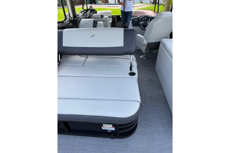 Slide: The Image of 2023 Starcraft EXS 3 Q boat interior with gray seating and steering console. - 27