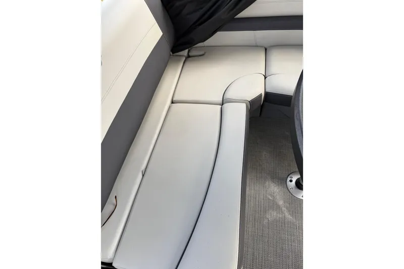 Slide: The Image of 2023 Starcraft EXS 3 Q boat interior seating with gray upholstery. - 29
