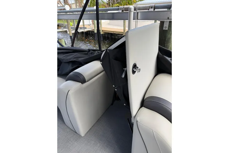 Slide: The Image of 2023 Starcraft EXS 3 Q boat interior with open storage compartment. - 37