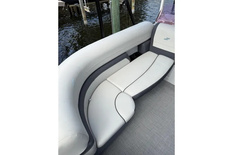Slide: The Image of Luxurious seating on 2023 Starcraft EXS 3 Q boat, featuring elegant white and gray upholstery. - 38