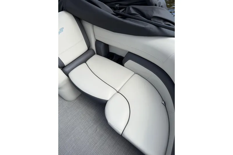Slide: The Image of Luxurious seating in the 2023 Starcraft EXS 3 Q boat, featuring sleek white upholstery. - 40