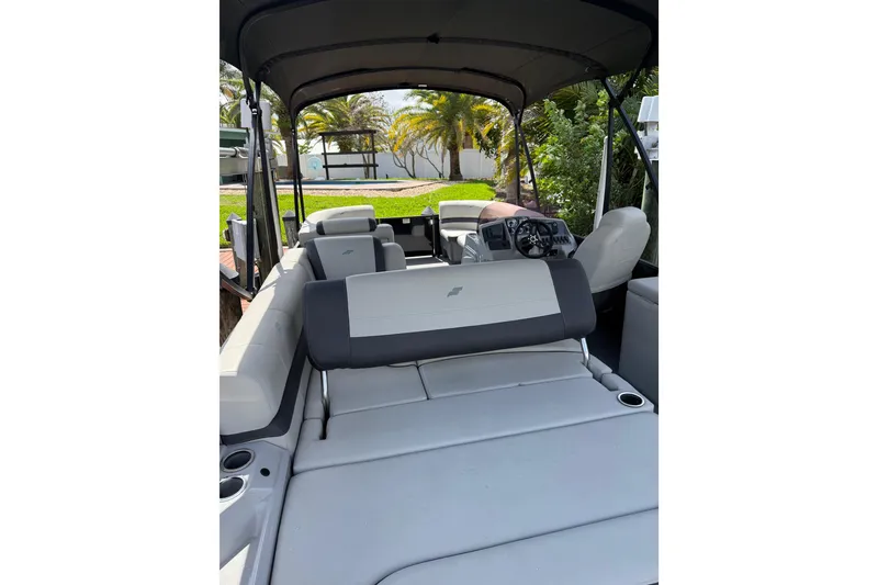 Slide: The Image of 2023 Starcraft EXS 3 Q boat interior with seating and steering console. - 7